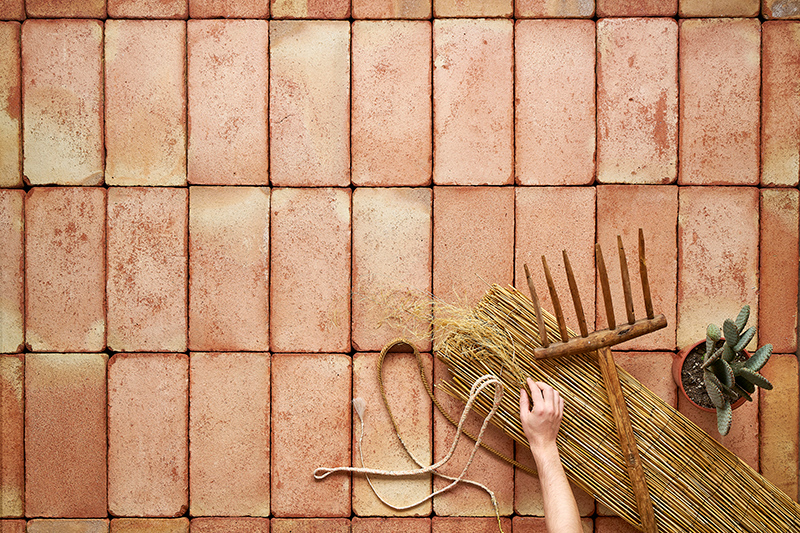 Close up of a terracotta ceramic salmon tiles floor