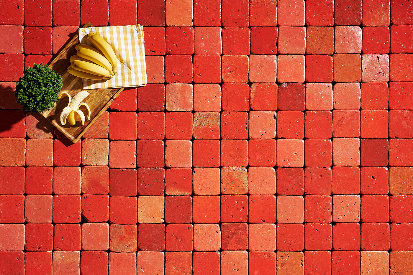 picture of a terracotta floor made of red tiles