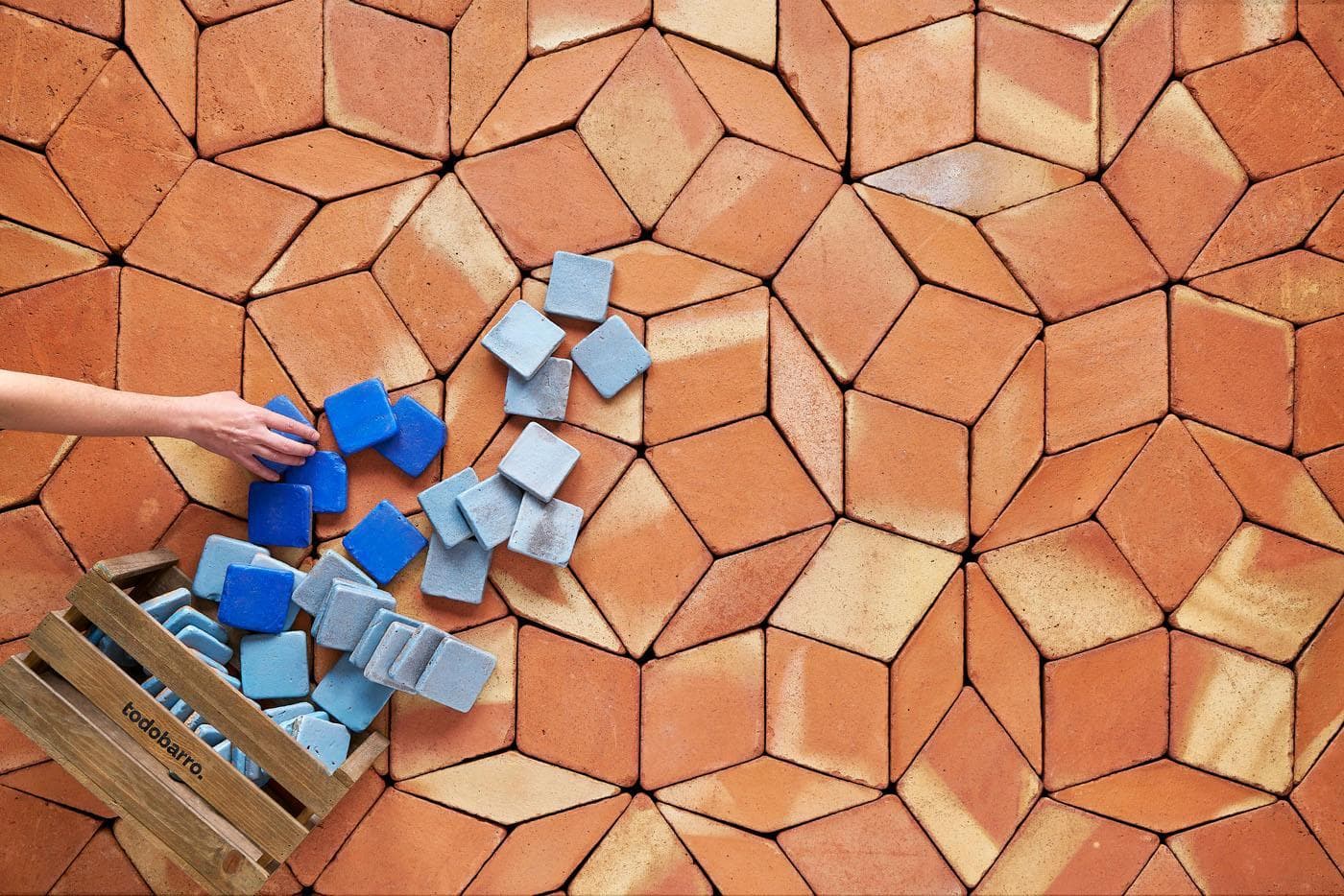 glazed ceramic tiles spilled over a terracotta floor