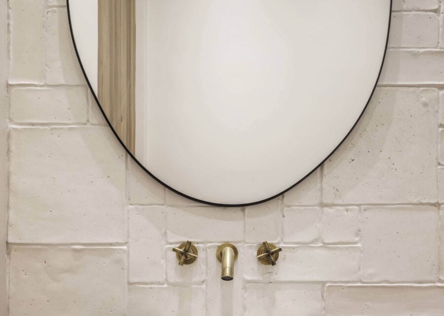 A natural fired clay wall for a bathroom full of character